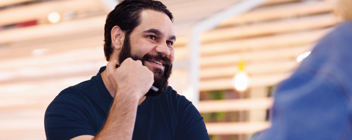 First Nations male sitting at table
