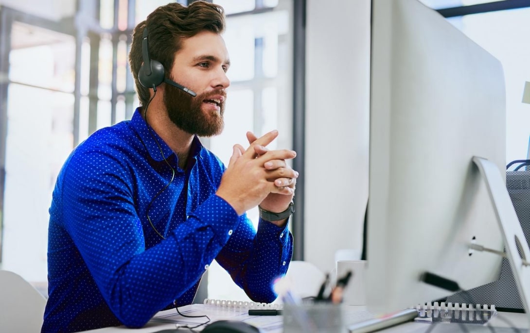 Man at desk on a call