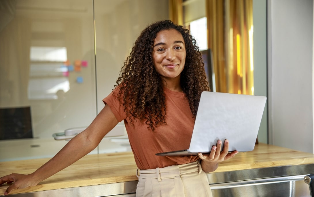 Woman holding laptop
