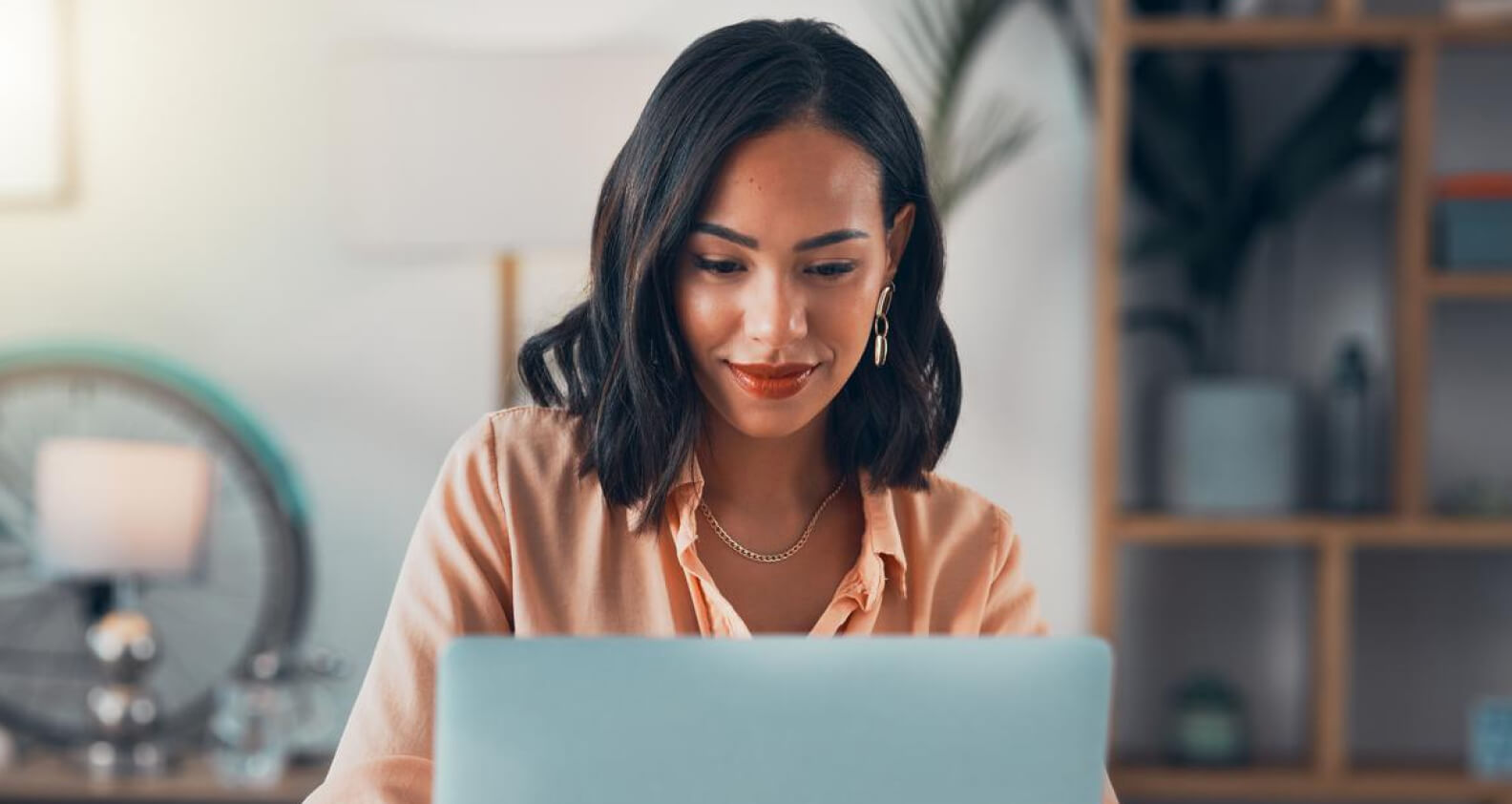 Woman looking at laptop