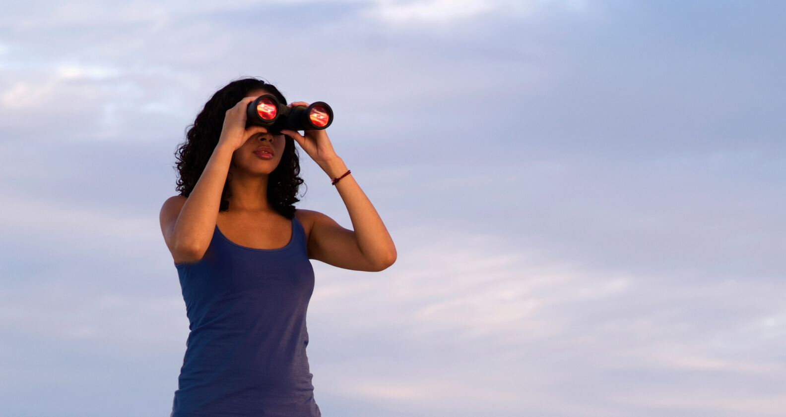 Person looking through binoculars